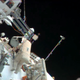 In this image made from video provided by NASA, Russian cosmonauts Pavel Vinogradov, left, and Roman Romanenko perform a spacewalk outside the International Space Station to gather old science experiments and install new ones, and replace a navigation device.
